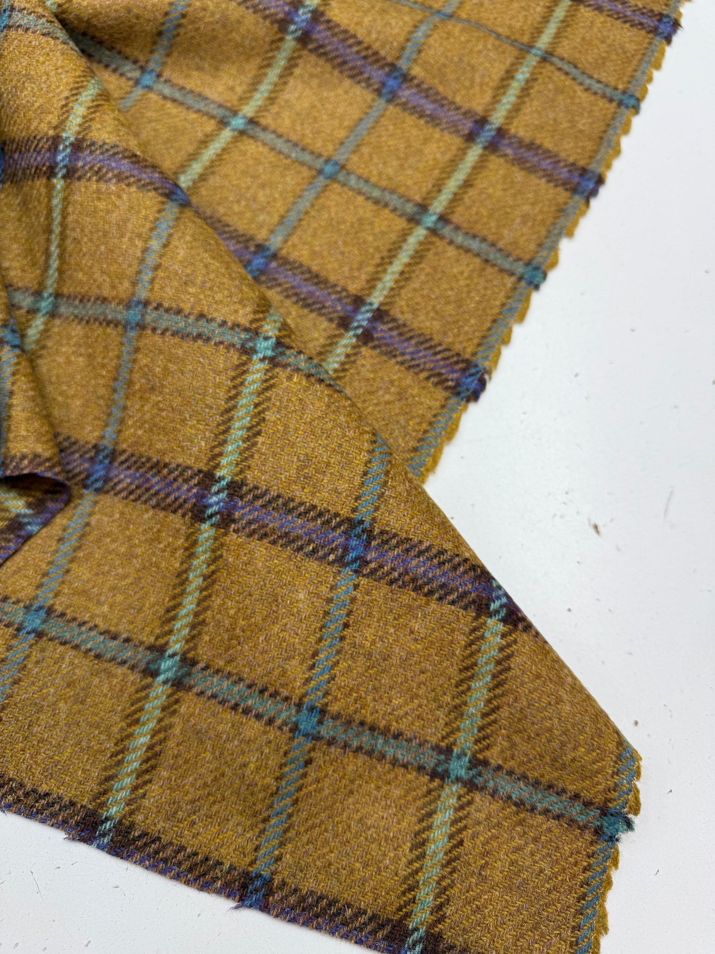 Wollen ruit oker beige blauw tinten 3.