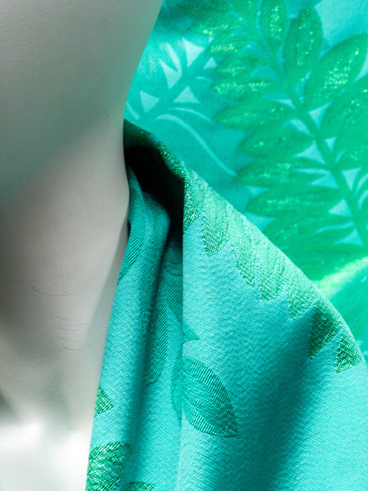 Jaquard lurex with green leaves